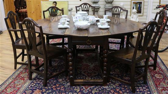 An antique oak gateleg table - the underside of the top carved with numerous names W.180cm
